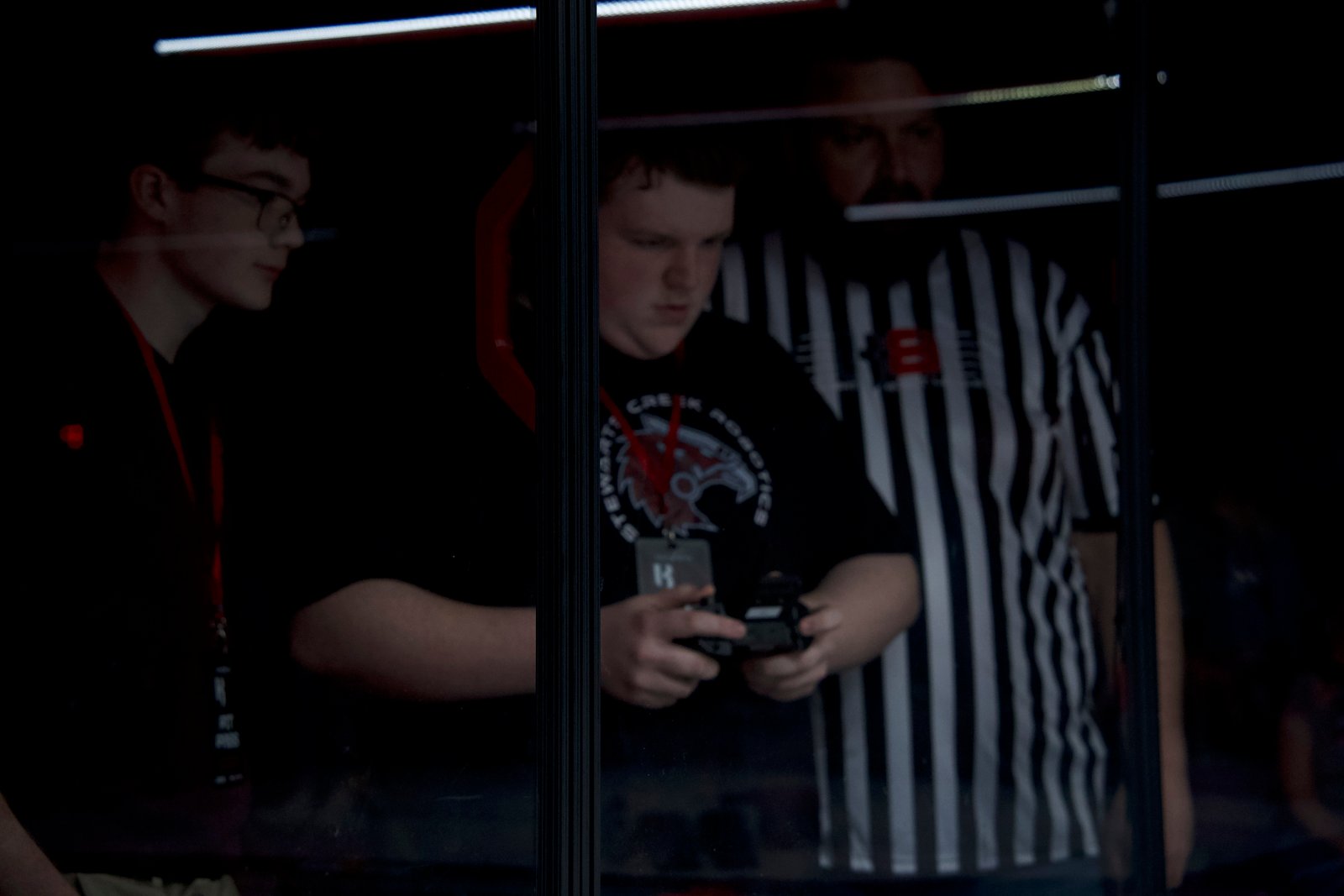 Students collaborating at the pit booth during competition